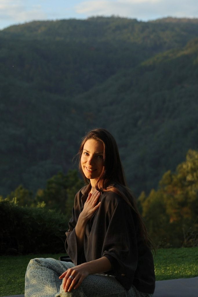 1. Portrait of Daria Gatska with mountain landscape background, outdoor photography.